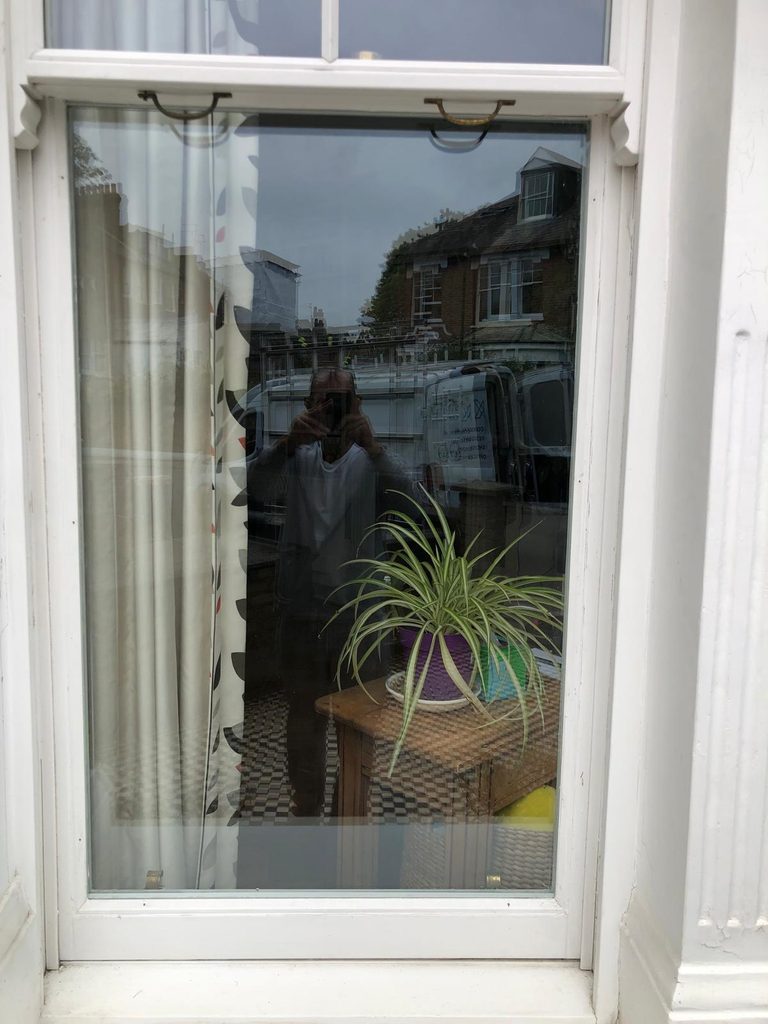 Smashed window glass on Gatcombe Road in Islington N19